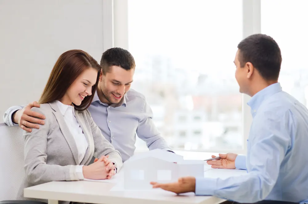 An advisor walking a couple through coverage plans at the table